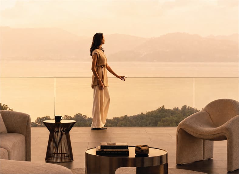 Woman on a terrace overlooking the sea