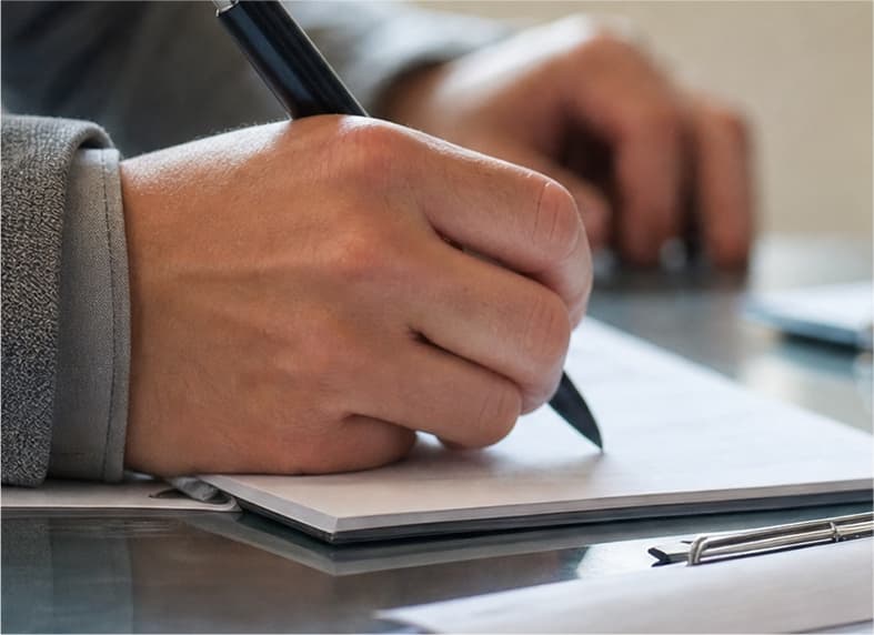 Buyer signing property documents